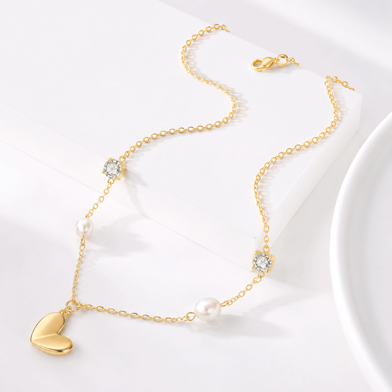 Brass option for a custom pearl heart pendant necklace with gold plating.