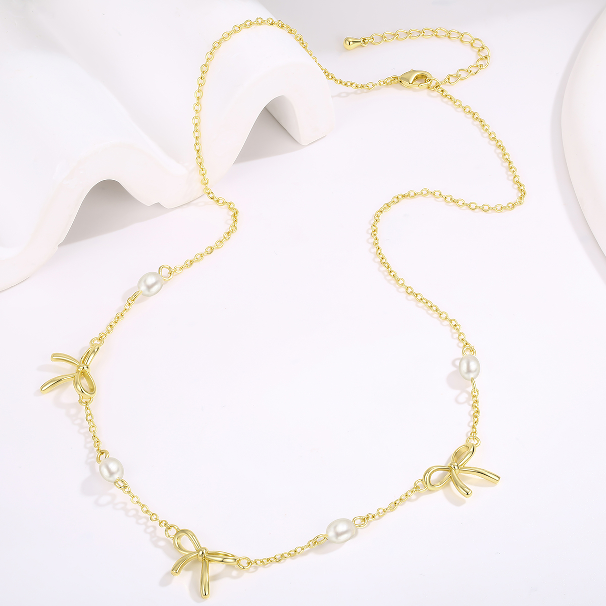 Custom pearl bow necklace developed for jewelry brands and private label projects