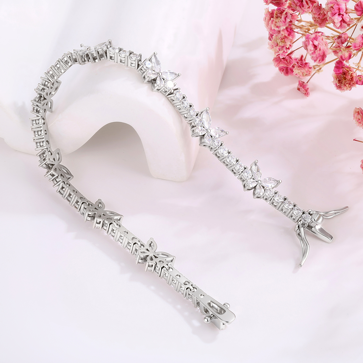 CZ tennis bracelet wholesale design with butterfly motifs and clear stones