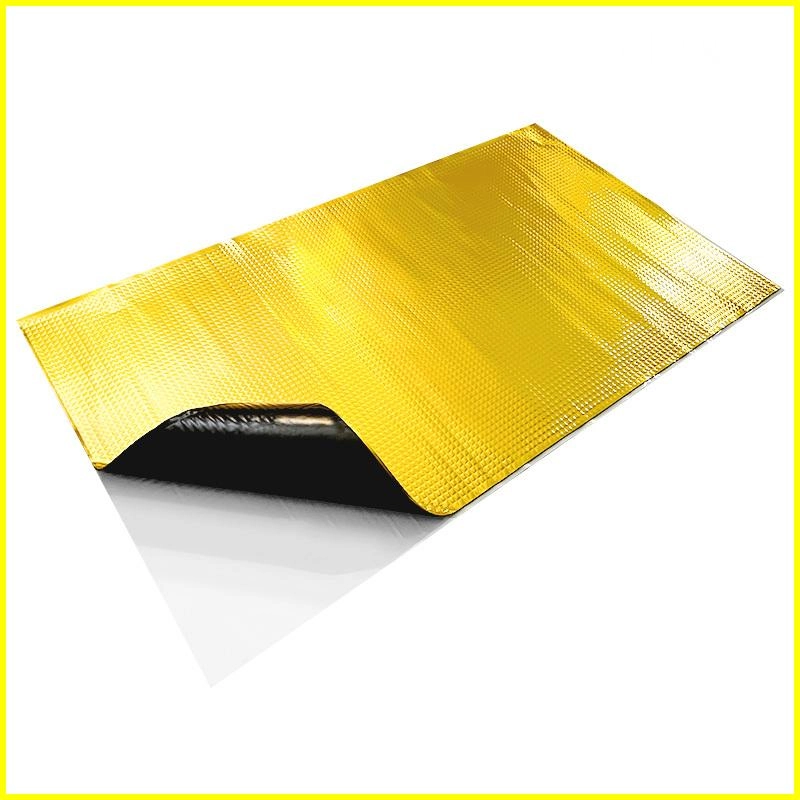 Gold heat shield mat with black adhesive backing.