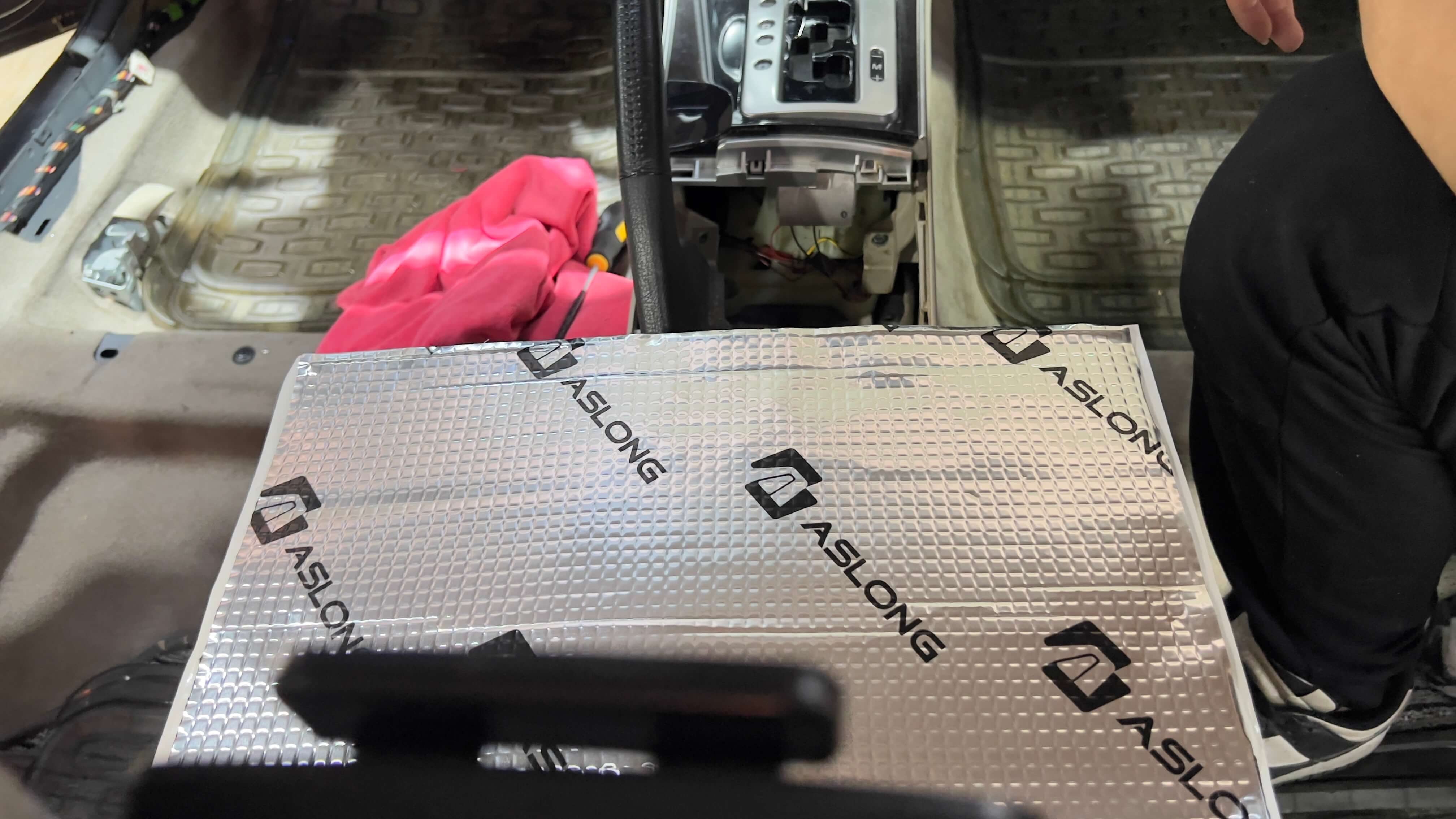 ASLONG branded sound deadening mat ready for car installation.