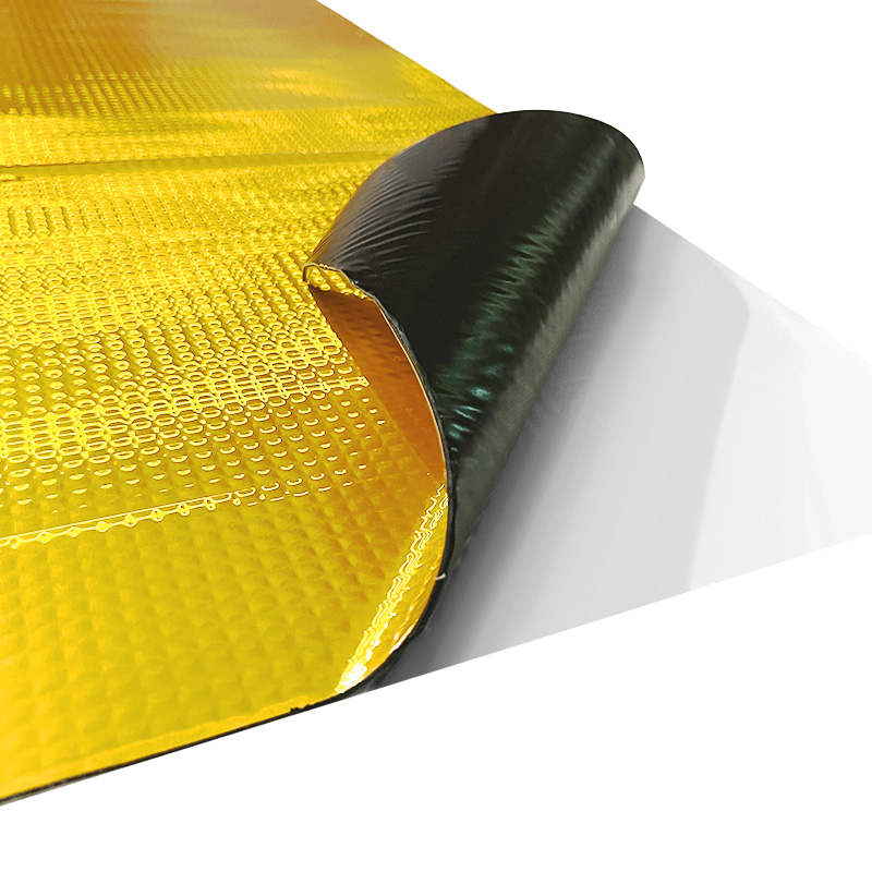 Reflective insulation material with a gold foil-like surface and black backing.