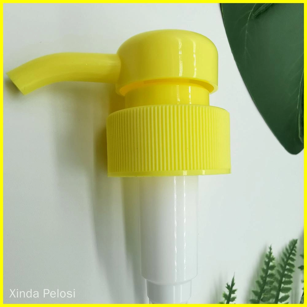 A yellow plastic pump dispenser with a ribbed neck and a long curved nozzle.