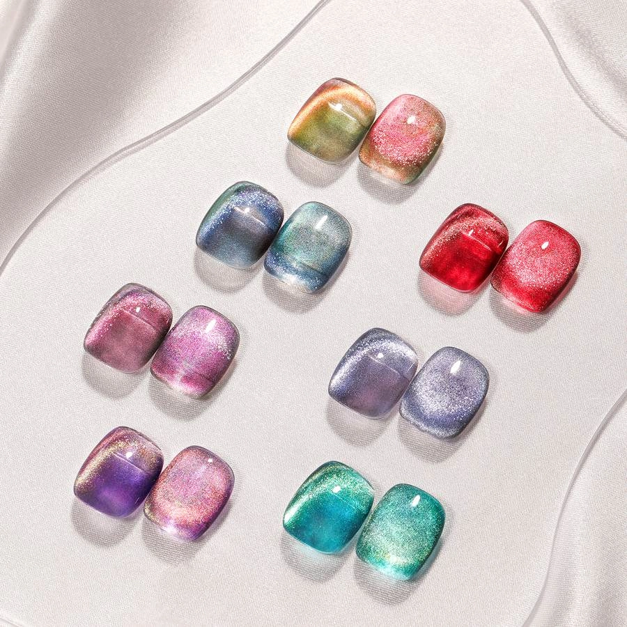 A-variety-of-cat-eye-nail-polishes-in-different-colors. A variety of cat eye nail polishes in different colors.