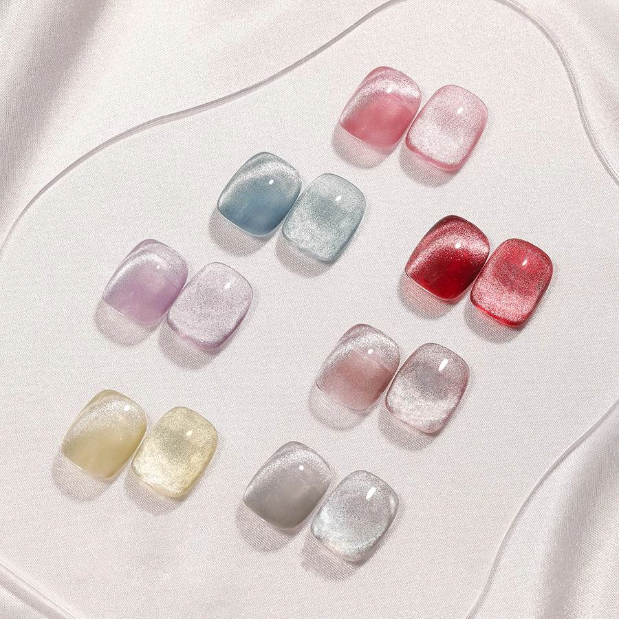 A variety of crystal cat eye nail polishes in different colors.