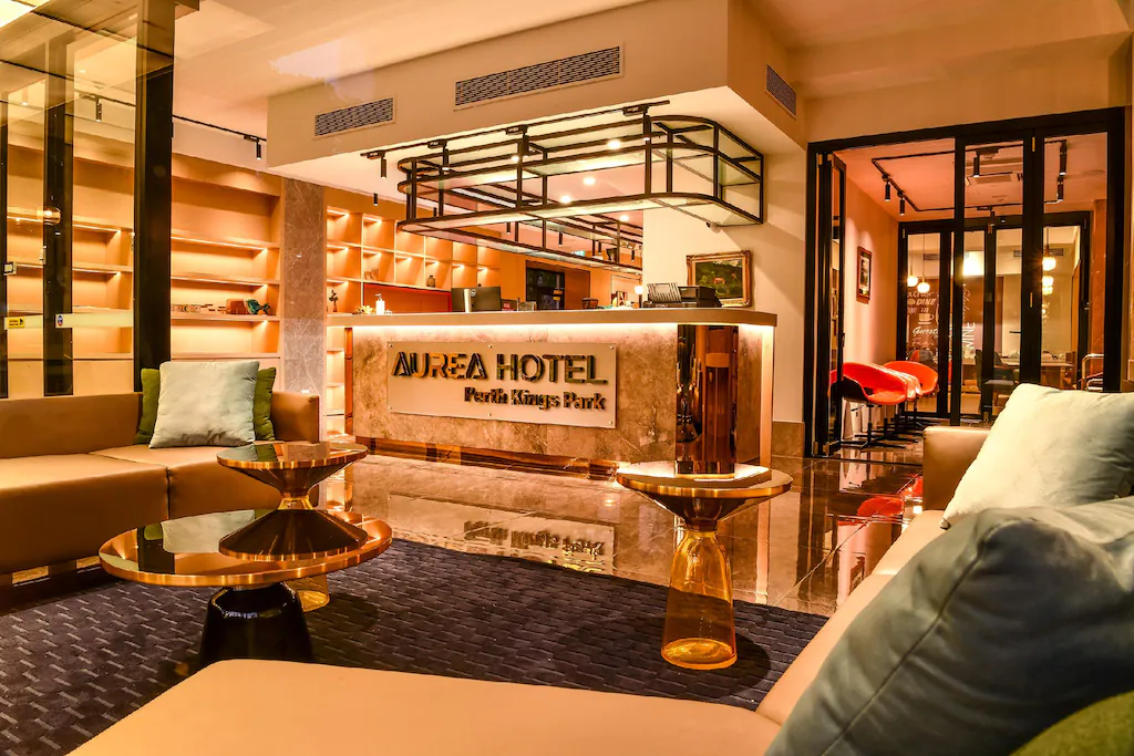 Aurea Hotel Perth Kings Park lobby with reception desk, lounge seating, and modern decor.