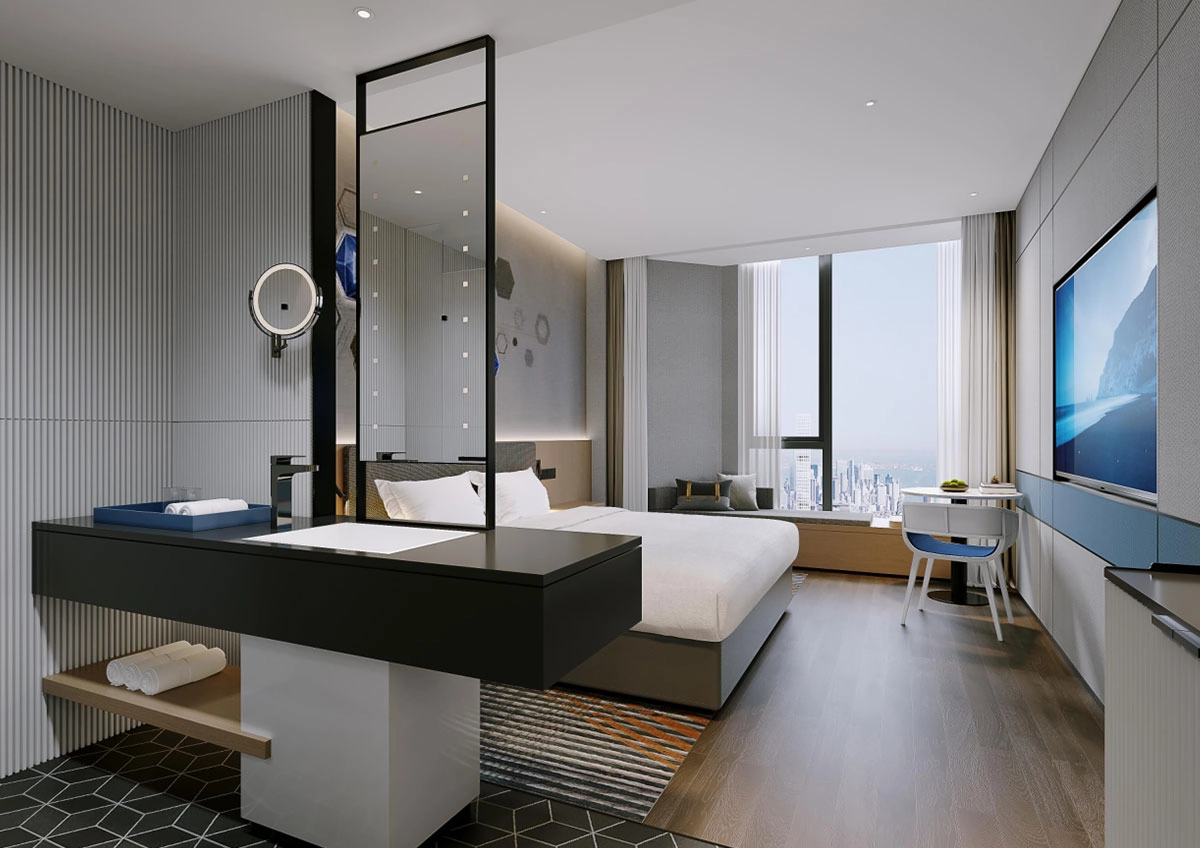 Modern hotel room with city view, bathroom vanity, and entertainment area.