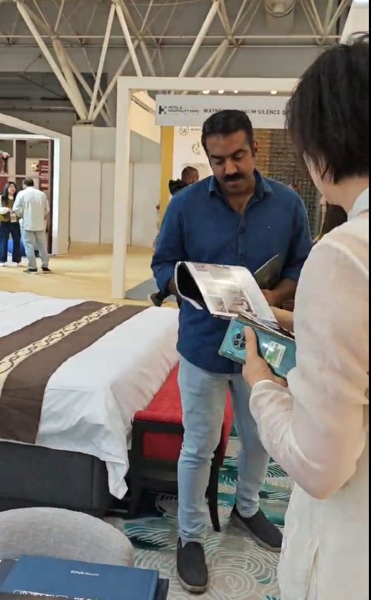 Starjoy Furniture booth with visitor