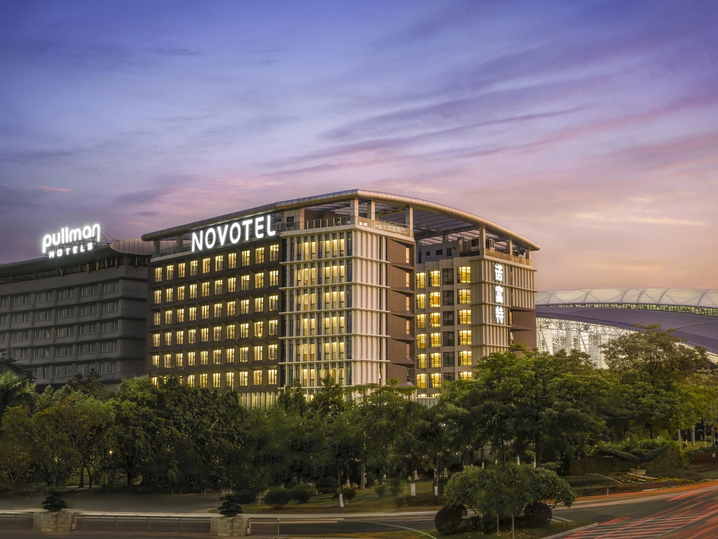 Novotel and Pullman Hotels at dusk.