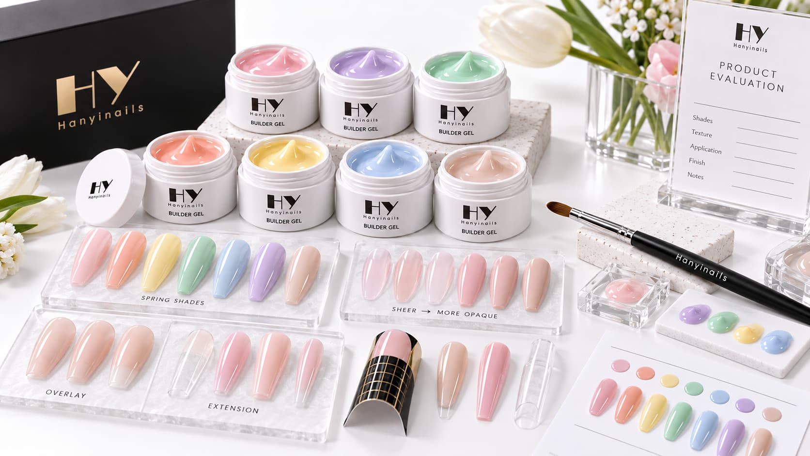 Colored builder gel products with spring shade samples, sheer and opaque nail examples, overlay and extension samples, tools, packaging and product information for professional buyer evaluation
