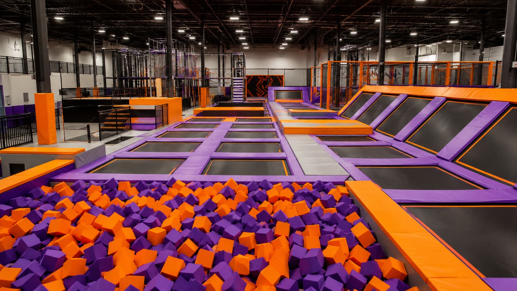 Indoor trampoline park design and manufacturing with foam pit and jump zones
