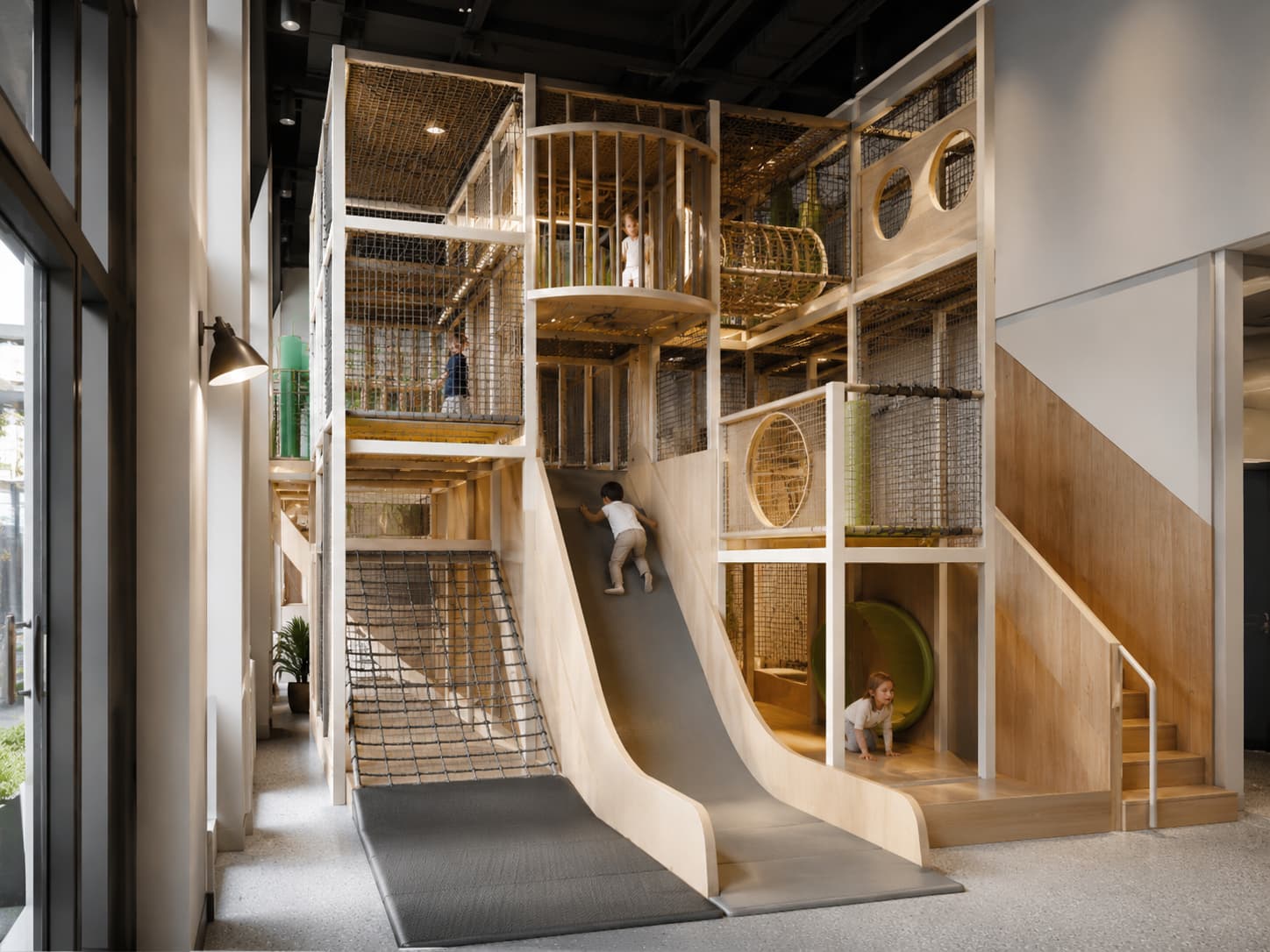 Multi-level indoor playground design maximizing vertical space in small areas