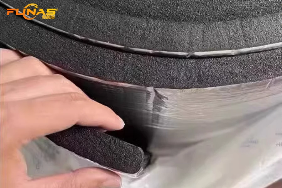 Cross-section of elastomeric insulation with aluminum foil facing