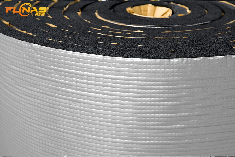 Embossed aluminum foil facing on elastomeric insulation roll