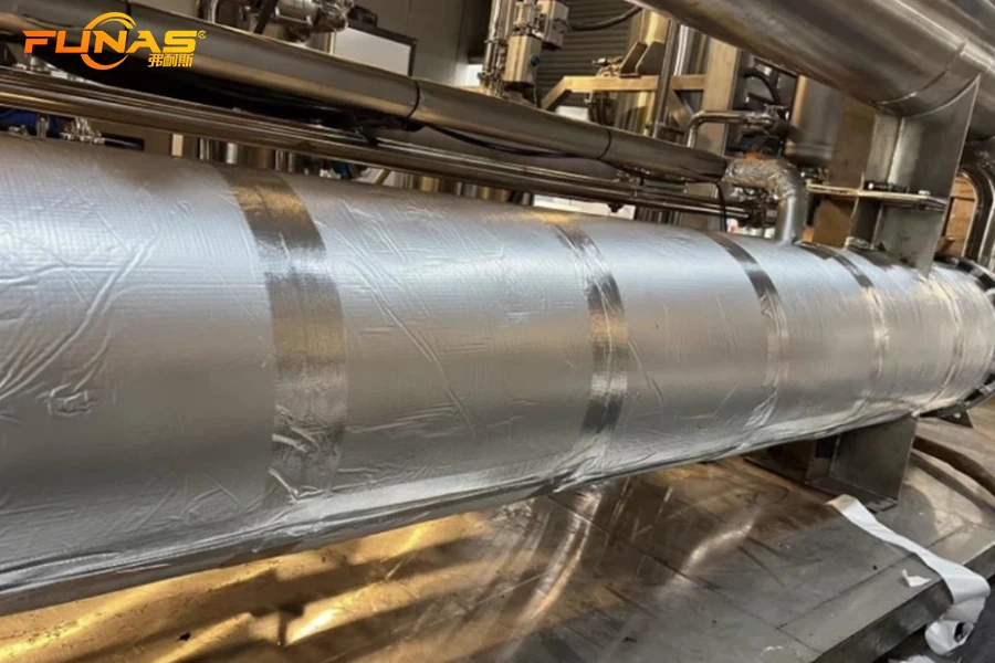 Foil-faced elastomeric insulation installed on industrial piping