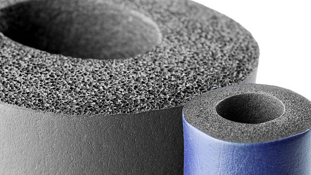 Close-up of two cylindrical pieces of closed-cell foam, one gray and one blue. - FUNAS
