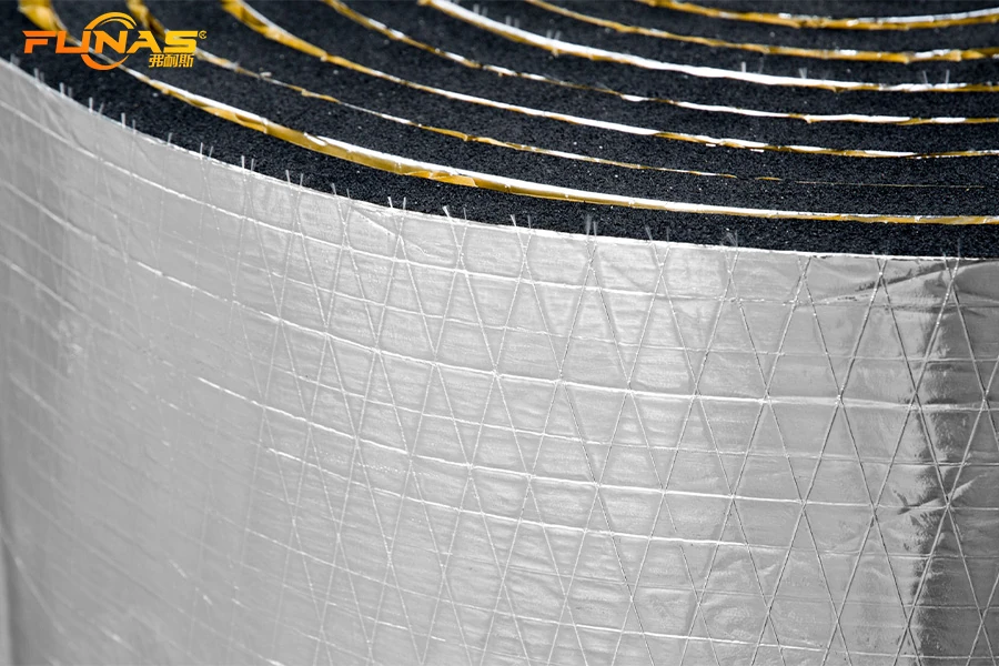 Reinforced aluminum foil facing on elastomeric insulation roll