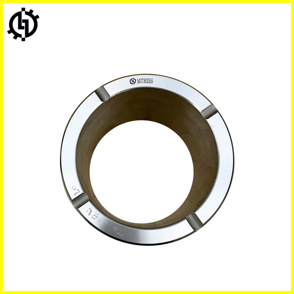 Close-up view of a silver MTB255 bushing, a cylindrical metal part with a central hole and markings indicating size and model number.