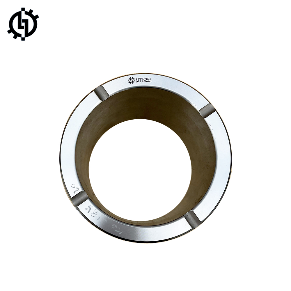 Close-up view of a silver MTB255 bushing, a cylindrical metal part with a central hole and markings indicating size and model number.