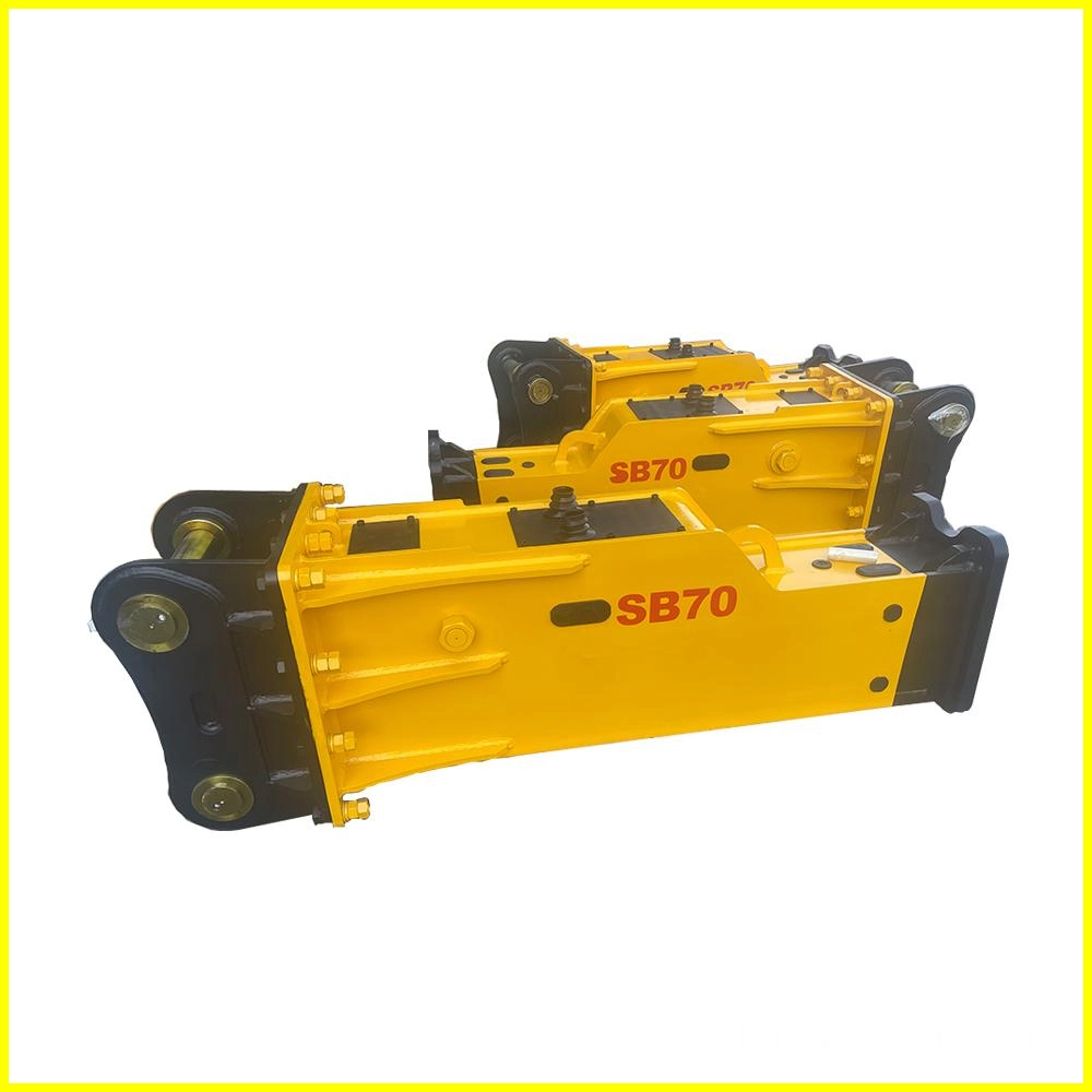SB70 Two yellow SB70 rock breakers, heavy-duty demolition equipment.