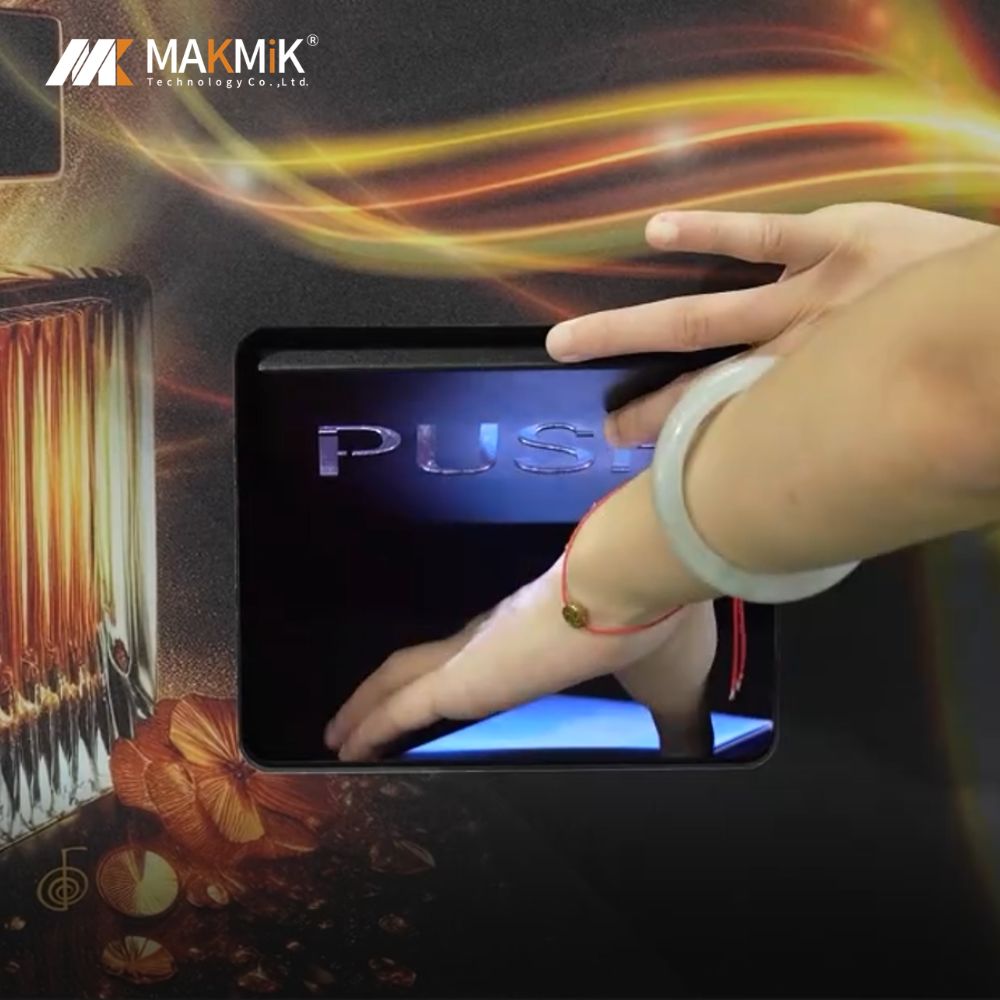 Retrieve the perfume from the dispensing slot of the MAKMIK perfume vending machine as a hand pushes the door.