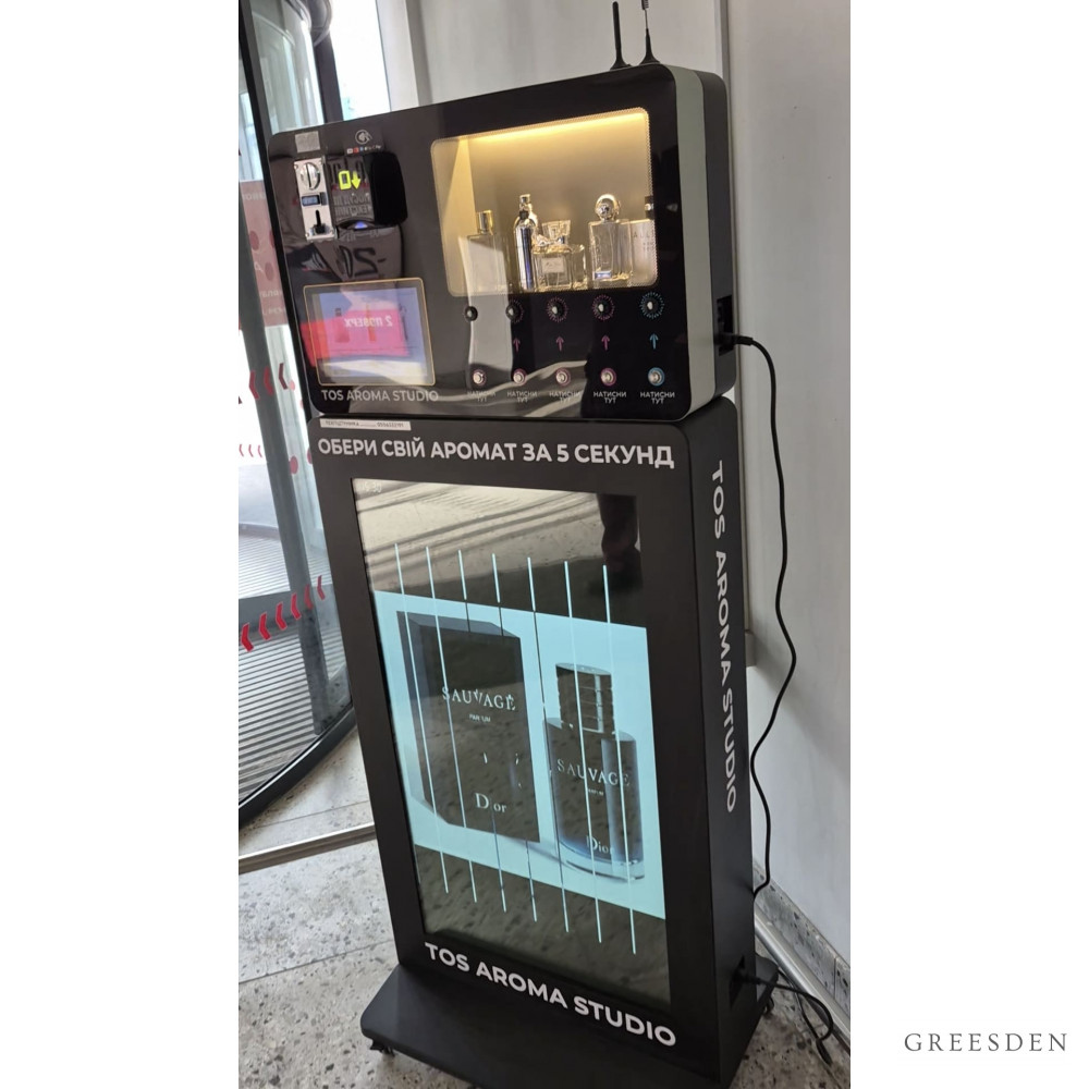 Ukrainian Greesden Perfume Vending Machine MK-PM-T001 with a digital display and fragrance bottles. Ukrainian Greesden Perfume Vending Machine MK-PM-T001 with a digital display and fragrance bottles.