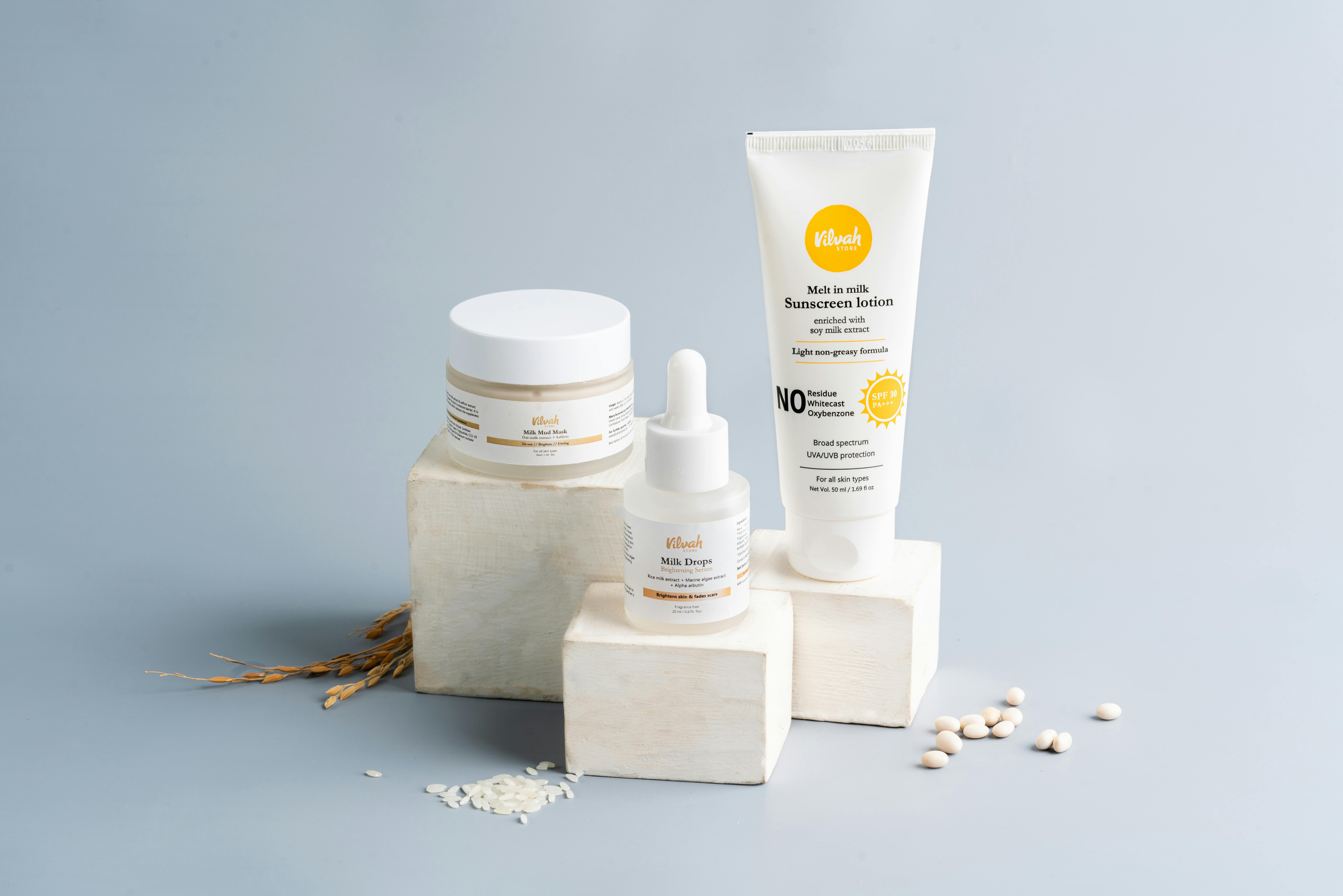 Elegant skincare and sunscreen products on a gray backdrop. Ideal for beauty marketing. Elegant skincare and sunscreen products on a gray backdrop. Ideal for beauty marketing.