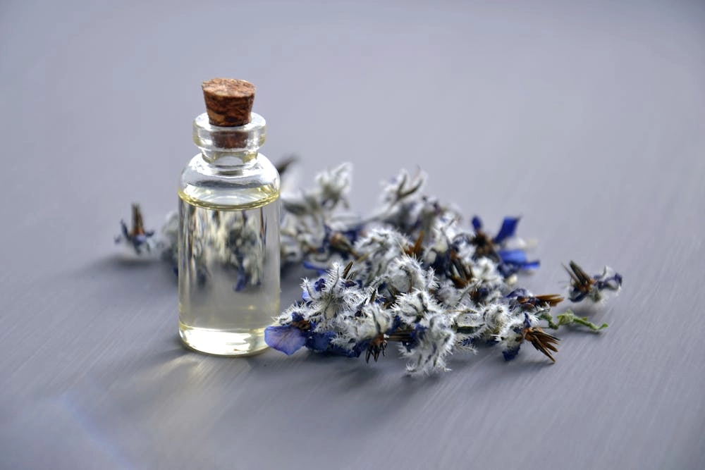 Fragrance-oils-in-a-bottle-with-flowers. - LEUXSCENT Fragrance oils in a bottle with flowers. - LEUXSCENT