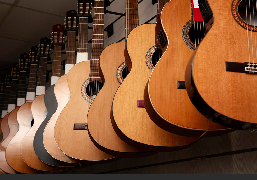 close-up-classical-acoustic-guitar-black-background_169016-13776