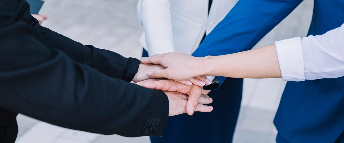 business-people-stacking-hands_23-2147710236