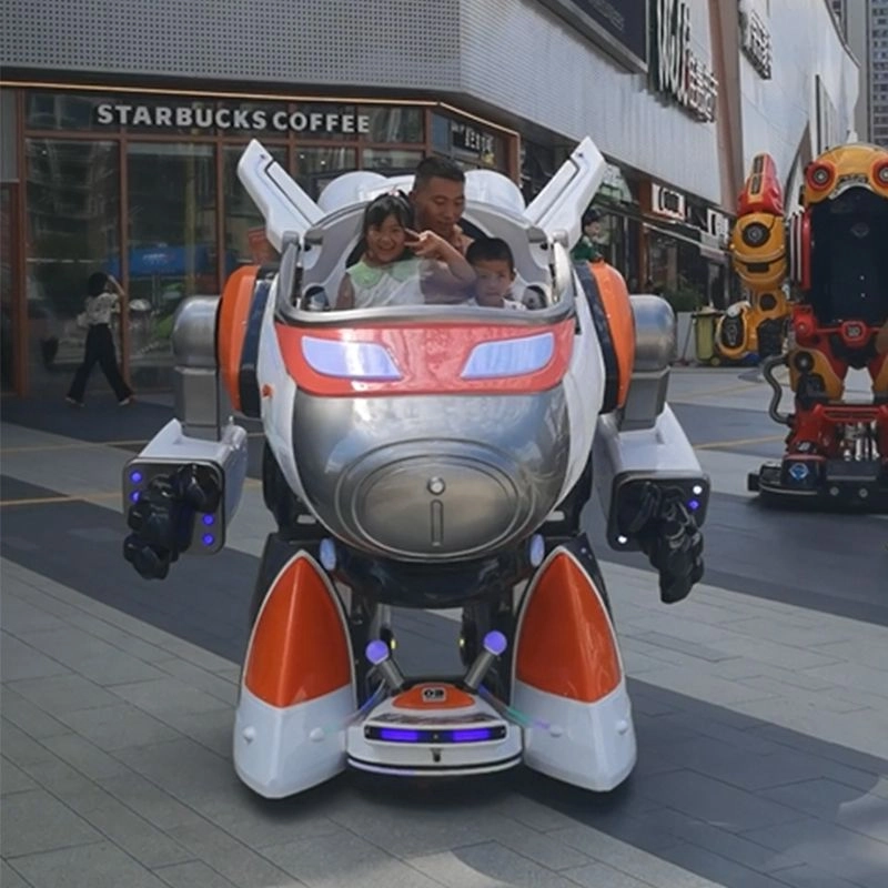 A father and two children ride in a large aviark warrior kiddie robot ride outside a Starbucks - H.Q.Amusement