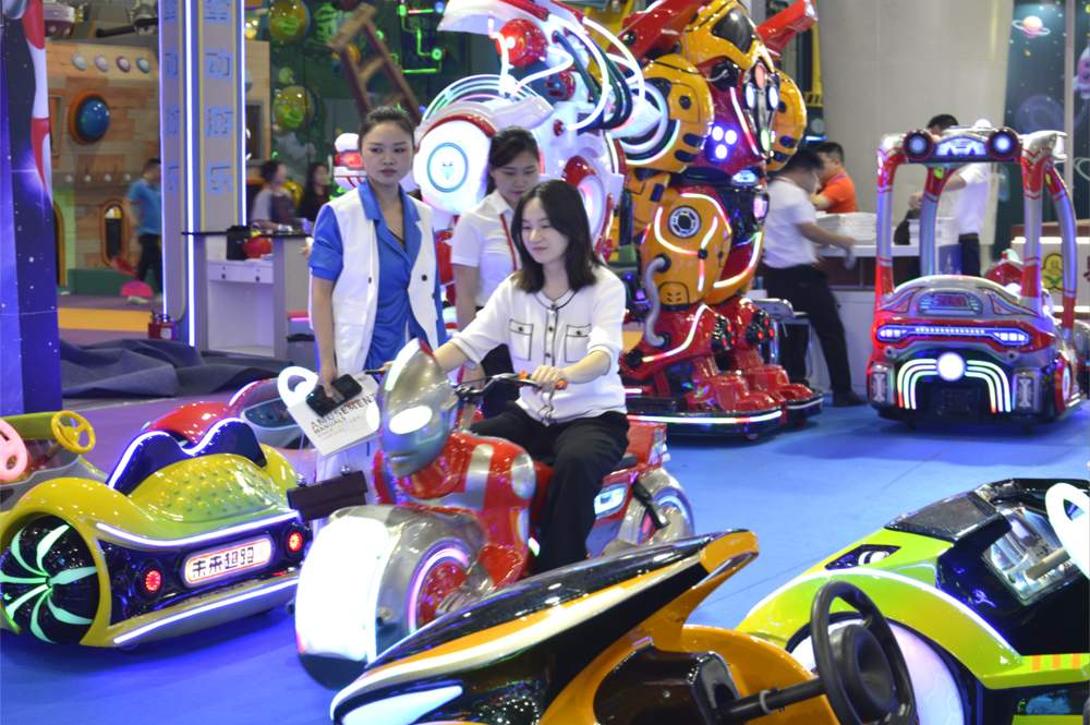 A young woman riding the Ultraman Electric Motorcycle
