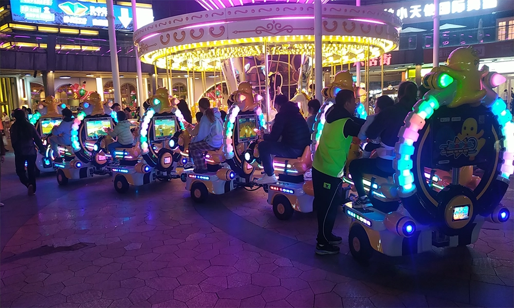 Children riding on illuminated nailong escort trackless train in a park at night - H.Q.Amusement