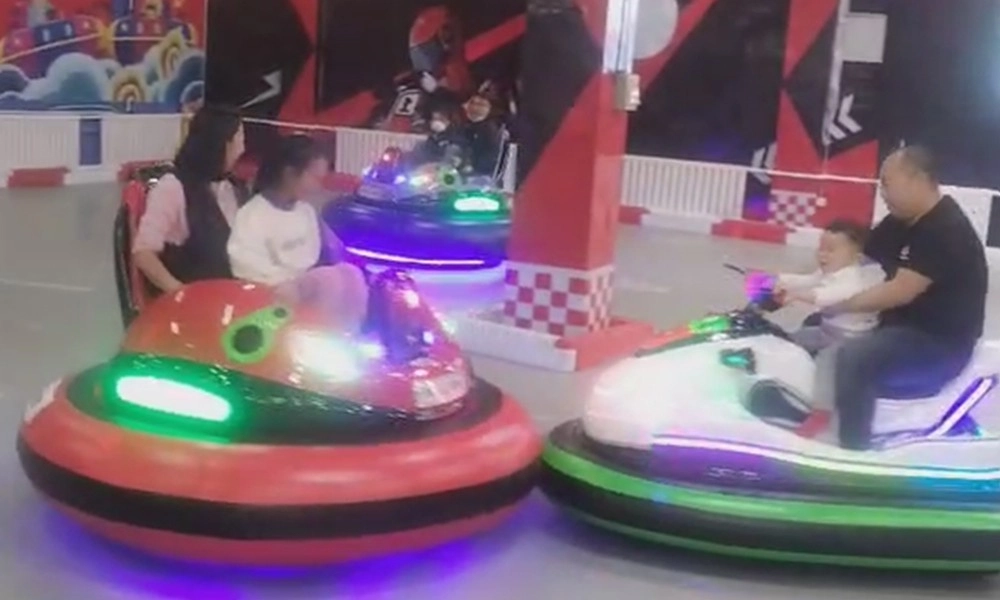Families enjoying bumper cars at an amusement park - H.Q.Amusement