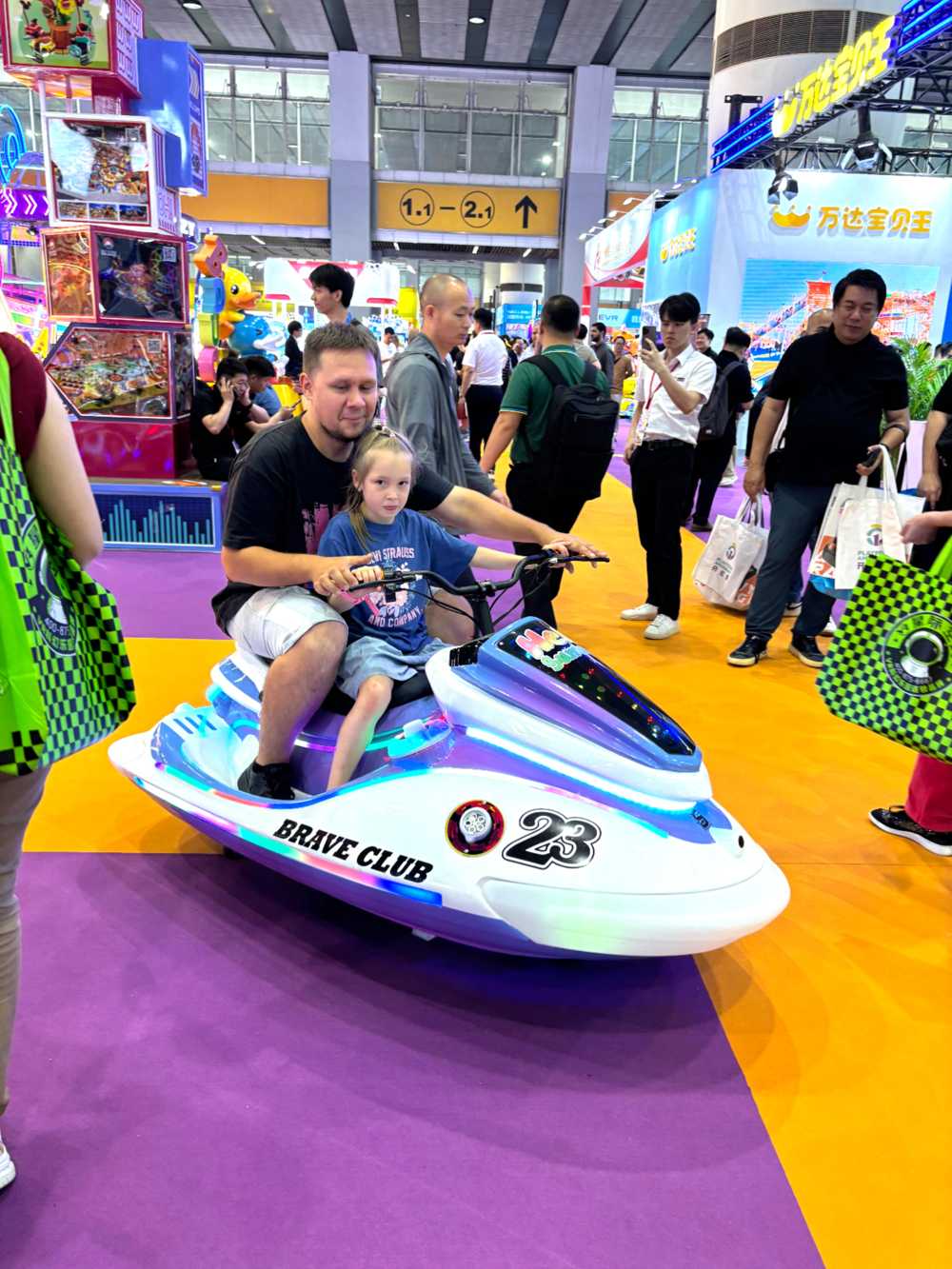 Father and daughter riding jet ski together