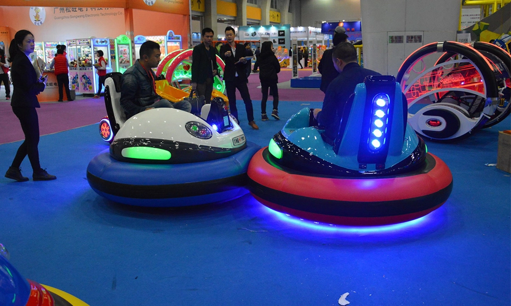 Indoor trade show display of illuminated bumper cars and 360 rolling car - H.Q.Amusement