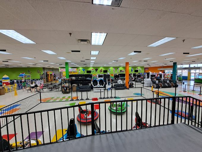 Indoor venue combining bumper cars with AR arcade gaming attractions