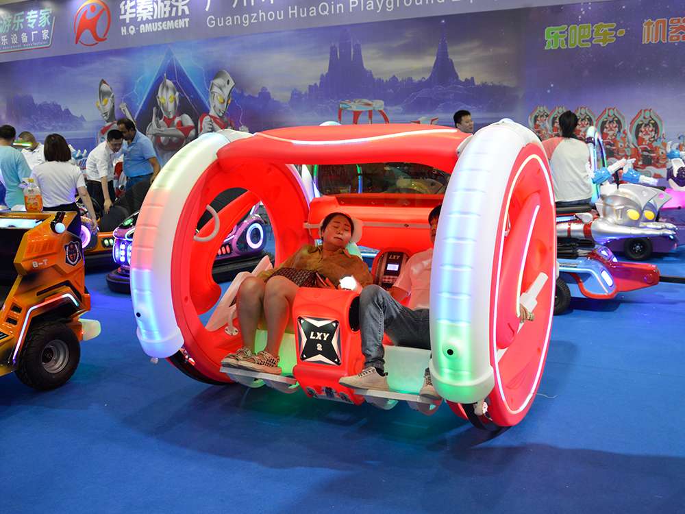 mother and son experiencing the Orange 360 Moonwalk Car