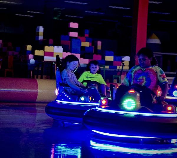 Nighttime operation of the bumper car arena with illuminated effects