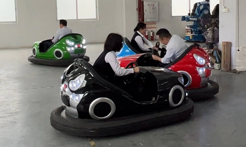 People in business attire driving parent-child bumper cars indoors - H.Q.Amusement
