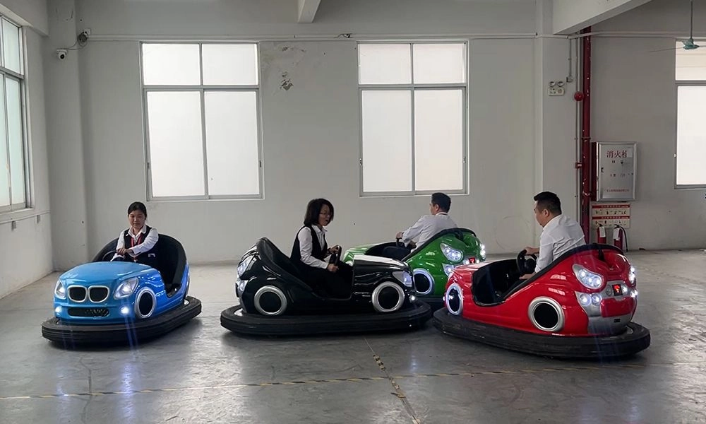 People in colorful parent-child bumper cars inside a building - H.Q.Amusement
