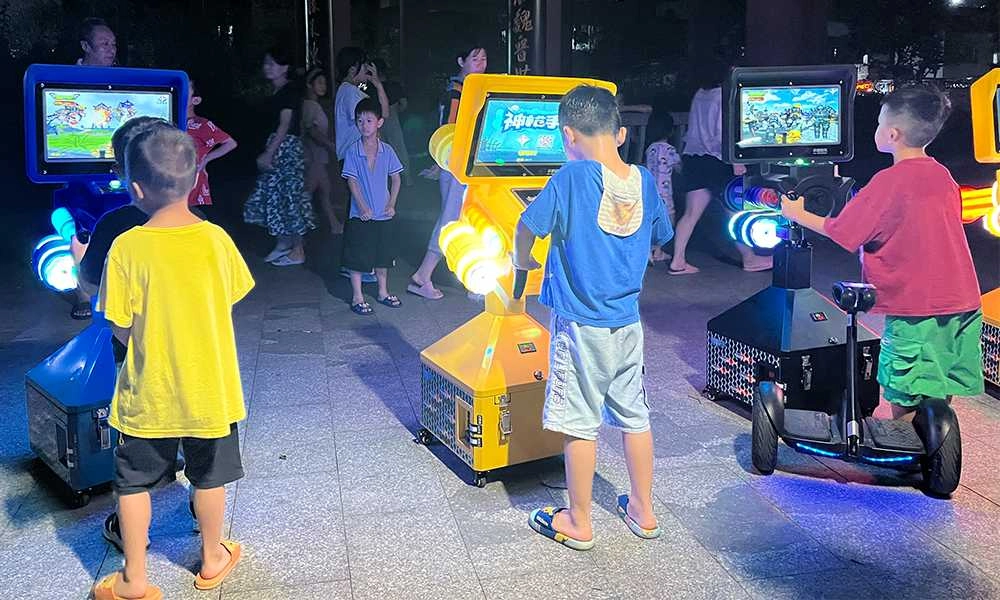 The boys are deeply absorbed in the Sharpshooter arcade game - H.Q.Amusement