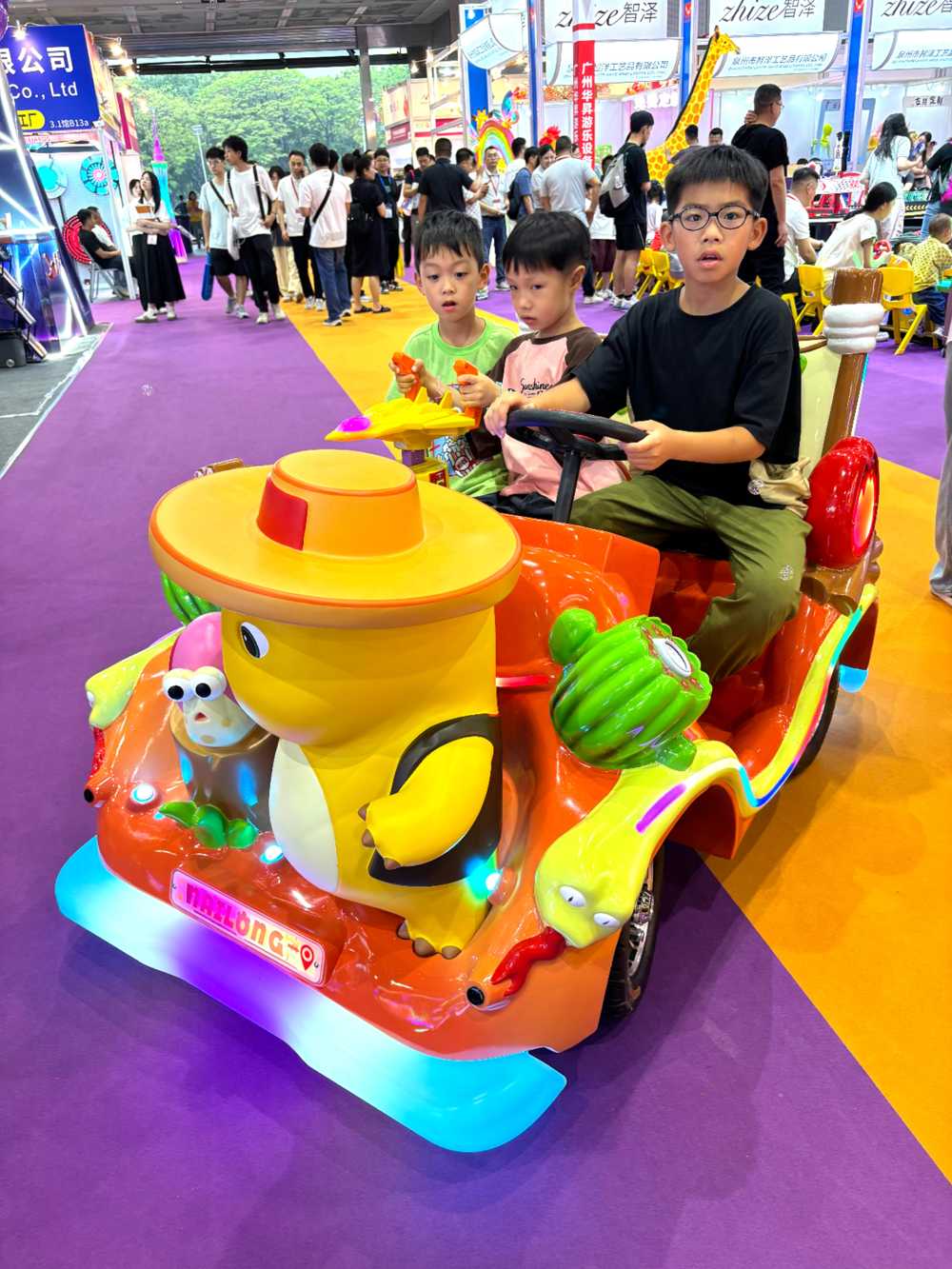 Three kids riding nailong animal rides together