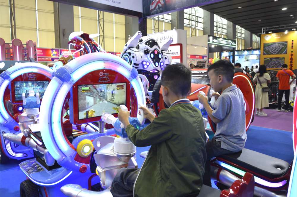 Two little boys playing the Trackless Train Shooting Game