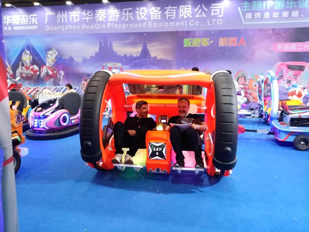 Two male friends experiencing the Orange 360 Happy Car