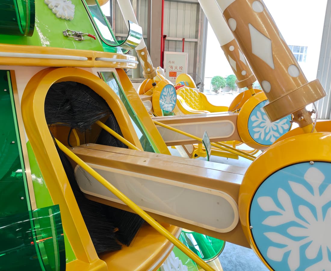 Close-up of a colorful amusement park ride featuring green and yellow panels. - SUNHONG