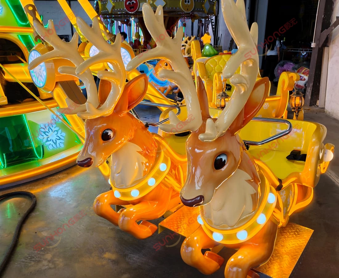 reindeer-carousel-ride-seats-glowing-antlers-amusement-ride.jpg - SUNHONG Two illuminated reindeer-shaped amusement ride seats with large antlers at an amusement park ride. - SUNHONG