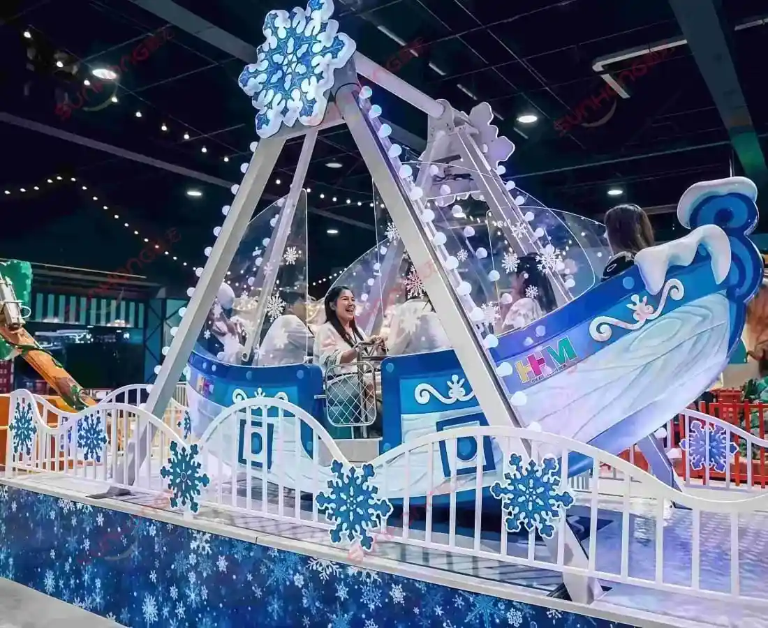 Indoor view of Amazing Ice Pirate Ship Ride with kids enjoying a mini pirate ship ride for sale