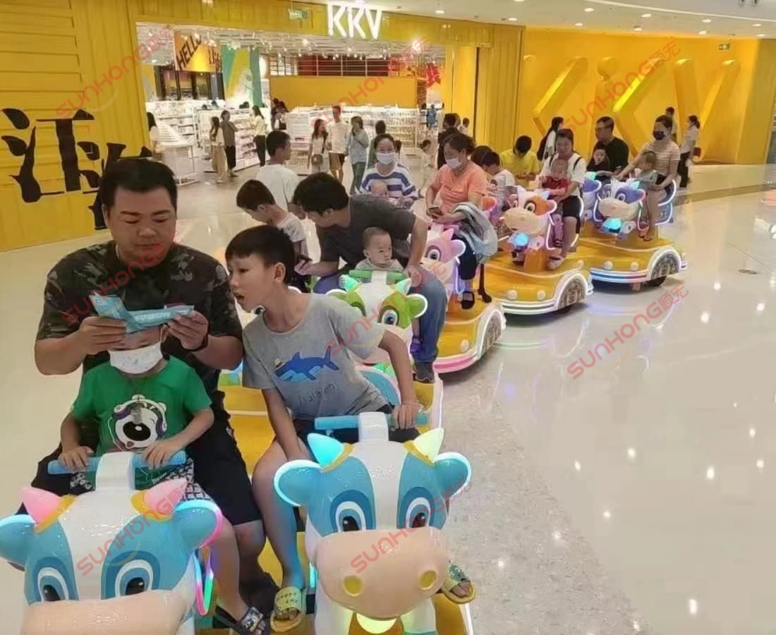 bull-themed-electric-train-with-kids-in-kkv - SUNHONG Indoor bull train ride for kids and parents, popular small trains for parks - SUNHONG