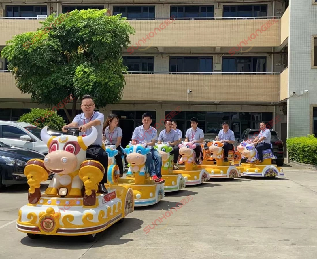 bull-train-demo-riding-outdoor-small-trains-for-parks - SUNHONG Employees riding Bull Train in a demo test outdoors, showcasing its usability as a small train for parks - SUNHONG